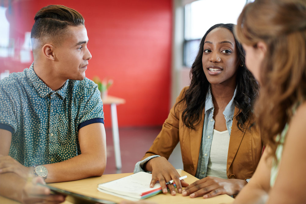 Group of business people collaborating around a table