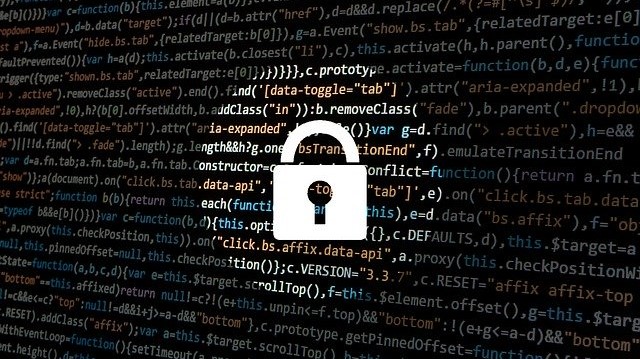 Padlock graphic overlayed against a screen of code